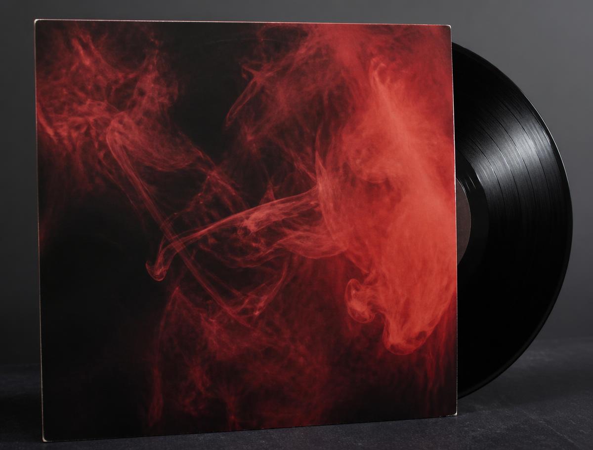 Album cover artwork with red smoke on a black background