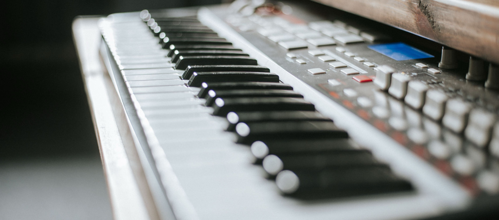 Close-up of a vintage synthesizer keyboard in a studio
