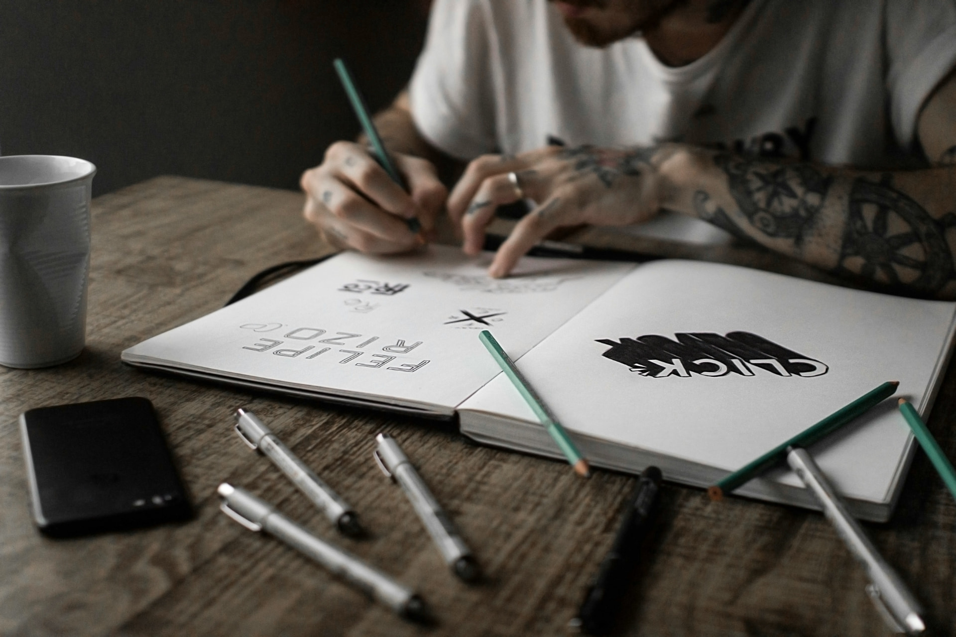 Creative director reviewing cover art proofs and color swatches