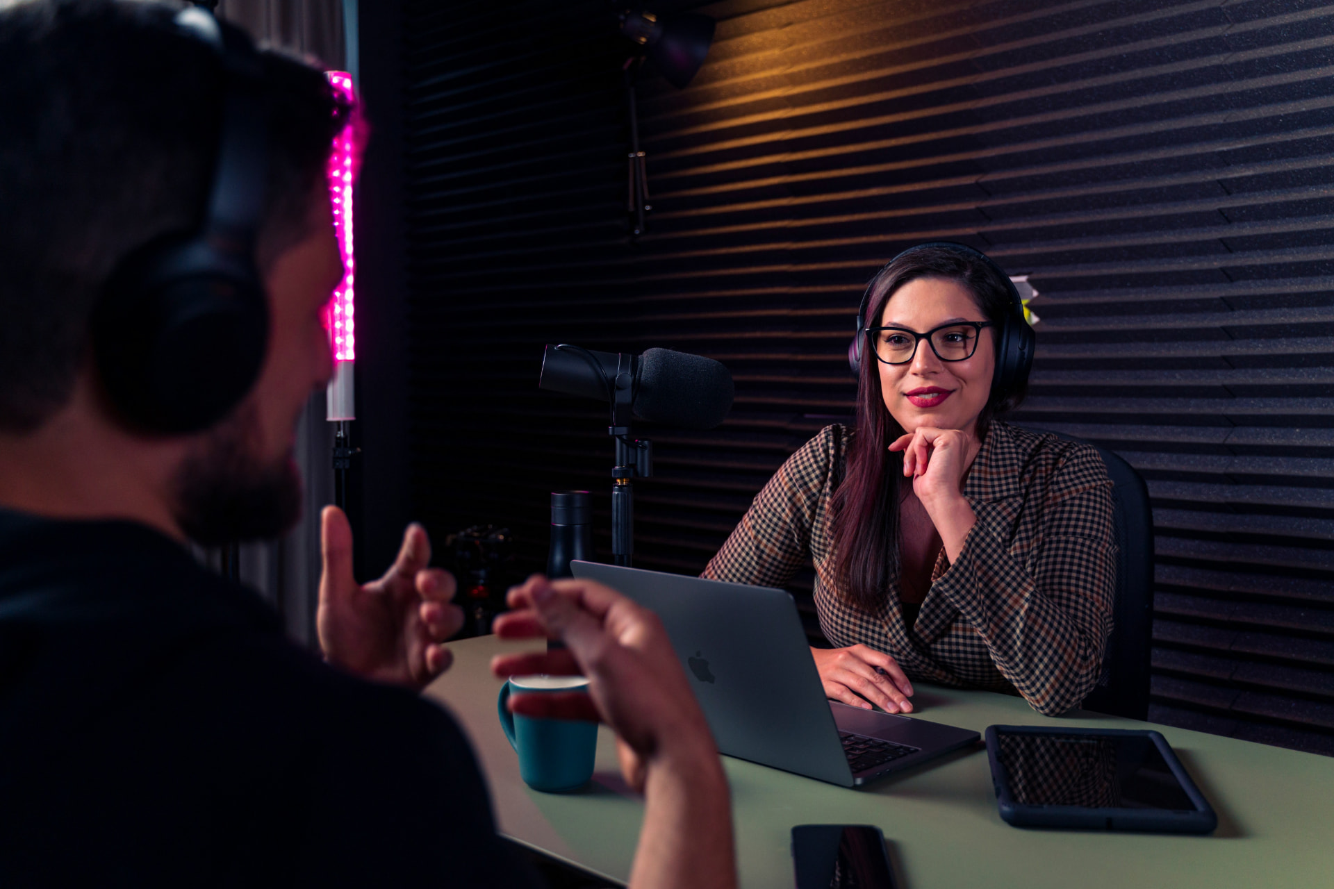 Musician being interviewed on camera in a media room